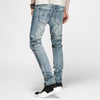 DISTRESSED ANKLE ZIP JEANS