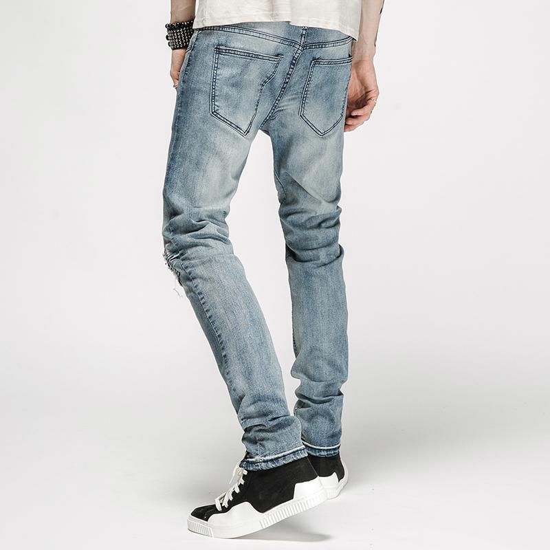 DISTRESSED ANKLE ZIP JEANS