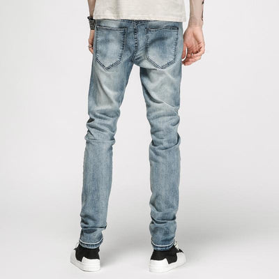 DISTRESSED ANKLE ZIP JEANS