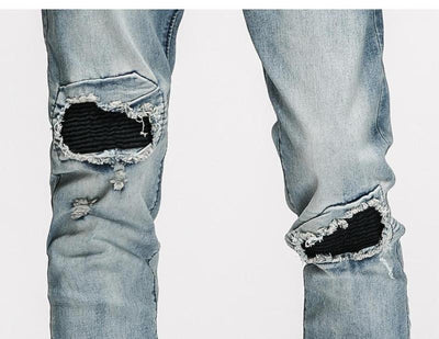 DISTRESSED ANKLE ZIP JEANS