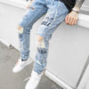 DISTRESSED GRAFFITI JEANS